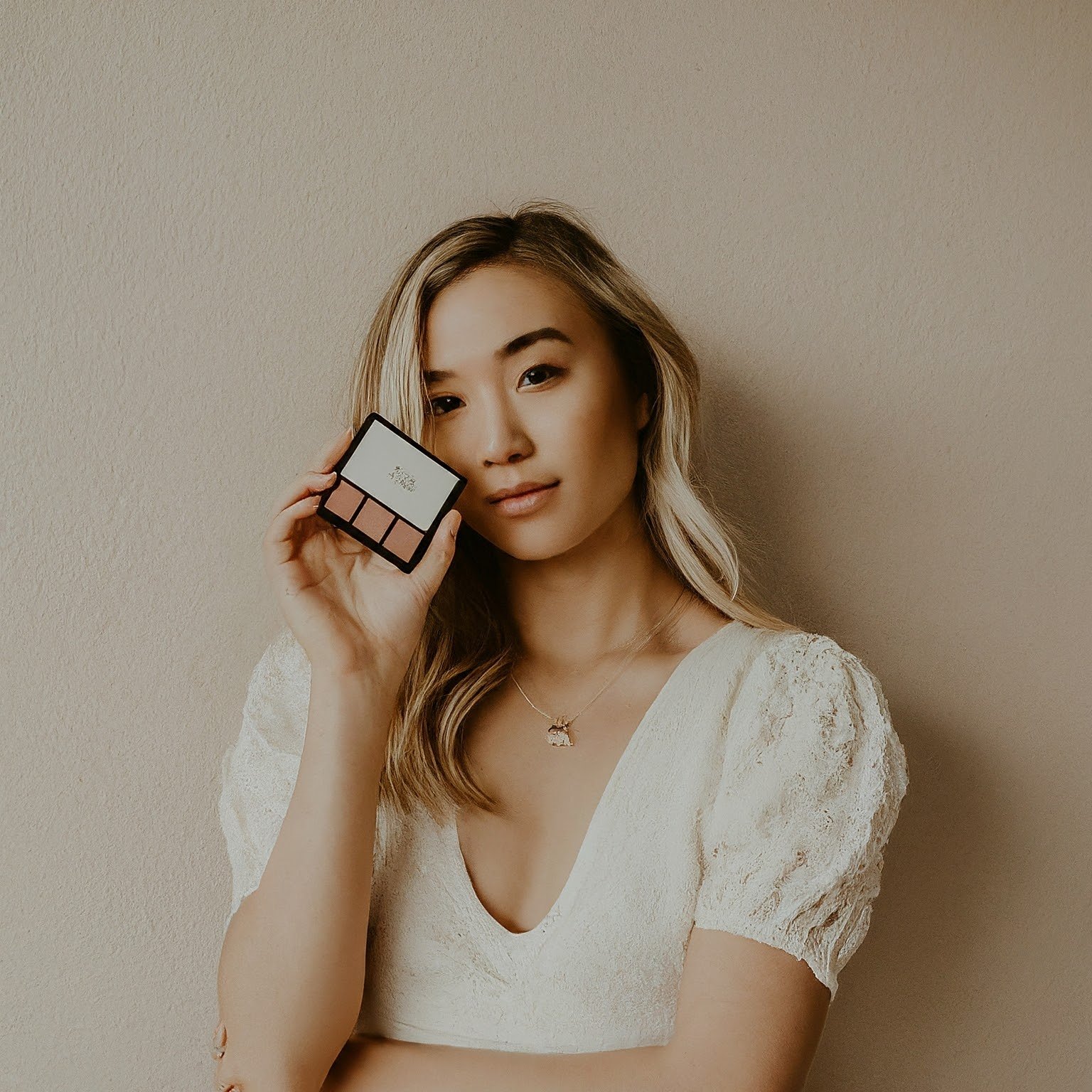 An influencer marketing a cosmetic cream